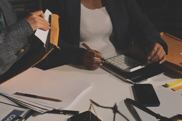 Businesswoman and Male lawyer or judge consult and conference having team meeting with client at law firm in office, Law and Legal services concept