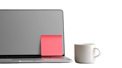 A blank laptop screen sits on an office desk next to a coffee cup, featuring a modern computer keyboard and technology equipment on a wooden table for business communication