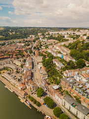 Bristol UK: 28th July 2025: Drone perspective captures the vibrant housing architecture in Bristol Harbourside with Clifton Suspension Bridge on the horizon