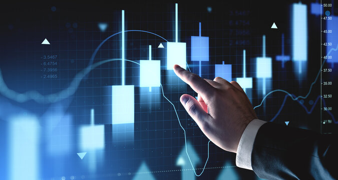 Businessman hand interacting with digital forex candlestick chart on futuristic blue interface background representing investment and market analysis concept. - Powered by Adobe