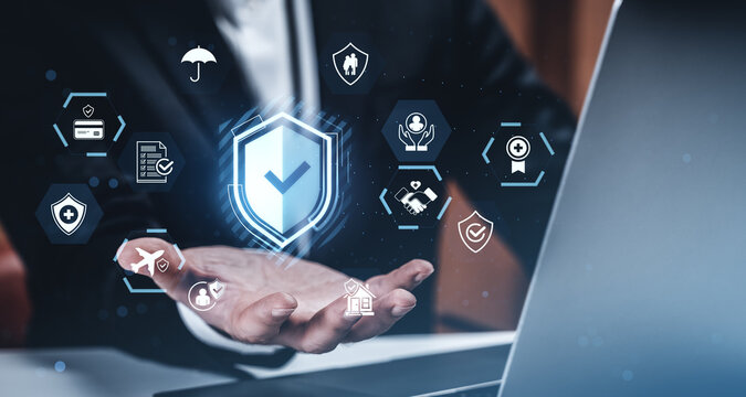 Businessman presenting digital insurance icons with hologram shield concept in futuristic interface on blurred office background using technology tools. - Powered by Adobe