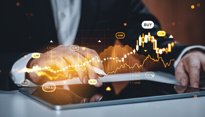 Businessman analyzing forex and crypto market graph on tablet with glowing stock chart concept in futuristic digital finance environment.