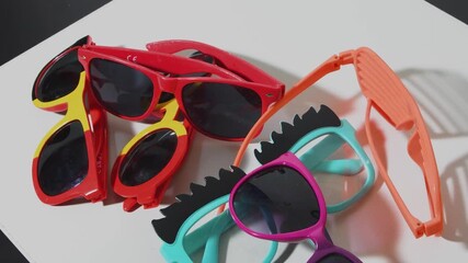 Funny glasses are removed as the party concludes with laughter and good memories at the celebration