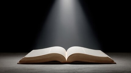 Dramatic Open Book with Spotlight Illuminating Pages in Dark Background Creating an Enigmatic Atmosphere of Knowledge and Mystery