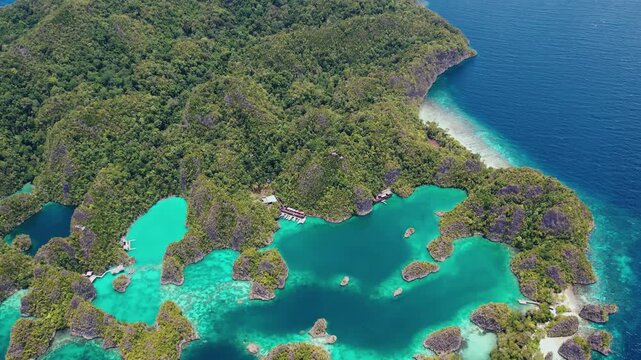 Raja Ampat, Indonesia: Aerial drone footage of the famous Piaynemo viewpoint plateform overlooking a stunning lagoon in the Fam islands in Raja Ampat in west Papua in Indonesia.