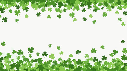 A festive St. Patrick's Day background with a scattering of green shamrocks on a white backdrop. © dinda
