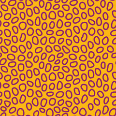 Abstract tiger inspired seamless pattern with purple organic spots on yellow.