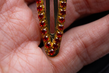 rhinestone hair clip with red rhinestones in a girl's hand