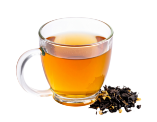 A clear glass mug filled with amber tea next to loose tea leaves.