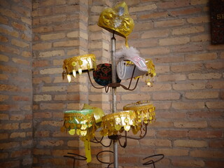 [Uzbekistan] Gold-decorated hat hanging on a pole (Itchan Kala, Khiva)