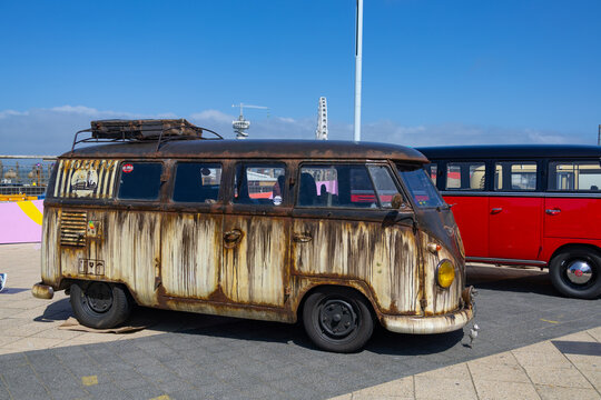 VW kombi camper vans on display at outdoor classic car show