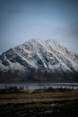 Snowy Mountain Peak Above a Quiet Fjord Landscape in Northern Norway