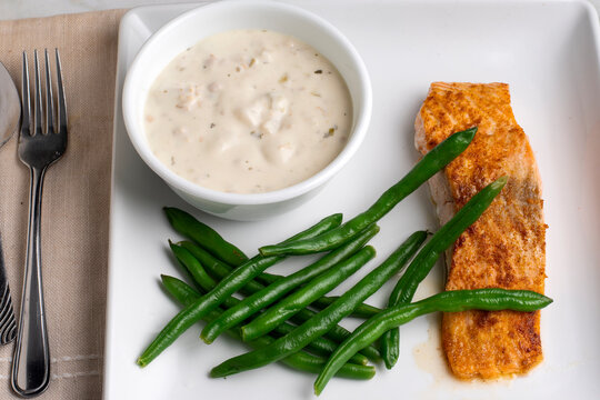 baked season salmon  with green beans and chowder
