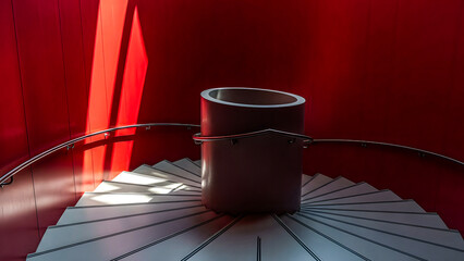 A metal bucket sits on a circular wooden platform surrounded by red walls and illuminated by a beam of light