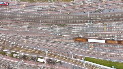 Aerial View of Halle Freight Railway Yard with Multiple Tracks and Cargo Trains