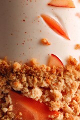 Panna cotta dessert with fruit slices and crumble topping, displaying sweet textures and gourmet presentation