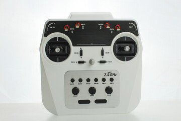 Obraz premium Remote control device for RC toys isolated on a white background. Suitable for hobbies, electronics, gaming, and toy accessories.