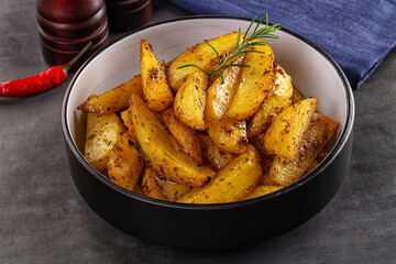 Baked crispy hot potato with rosemary