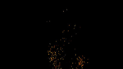 sparks and embers from campfire flying over black background