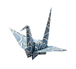 A beautifully crafted origami crane, showcasing intricate patterns and folds, captured in a studio setting.