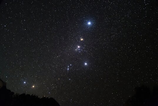 Orion constellation with its prominent stars against a deep dark night