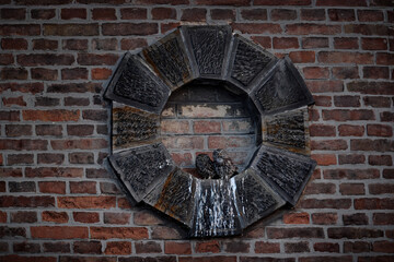 Owl - Urban wildlife with bird family. Birdwatching in Czech Republic. Young owl with mother near the nest. Little owl family, mother and chick, Athene noctua. Orange brick wall with two owls.