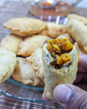 Delicious fried Curry Puff (Karipap) with savory potato filling