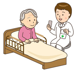 ベッドサイドでおばあさんに服薬指導する若い男性薬剤師