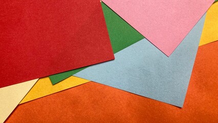 colorful papers, each offering a unique hue and texture, forming an abstract composition. capturing a playful yet minimalist aesthetic.