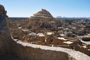 Remains of mud-brick houses of Shali fortress and Shali Mountain in Siwa Oasis, Egypt
