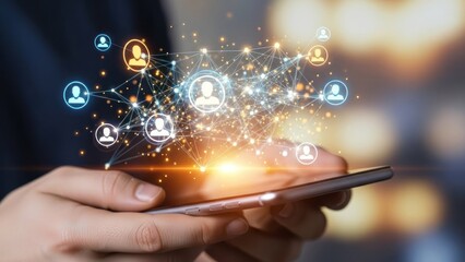 Hands holding smartphone displaying glowing network of user icons.