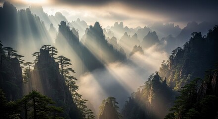 Misty mountain landscape with sunbeams.