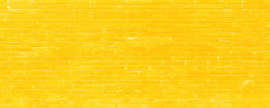 Old yellow brick wall panorama background texture