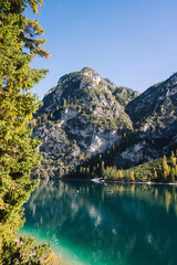 Mountain Lake Scene - Lago di Braies Italy Dolomites, Emerald green lake with mountains, alpine trees and alps landscapes - jigsaw puzzle and chocolate box perfect - sunny autumn fall day