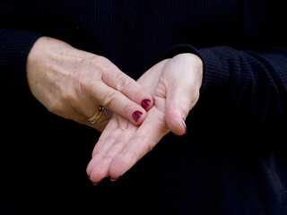 A pair of hands signing the consonant letter 'N' in British Sign Language.BSL.Communication.Hearing Impaired.