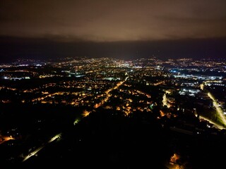 Obraz premium Satellite Observes Silent Suburban Patterns, Peaceful Night Illuminated By Household And City Lights