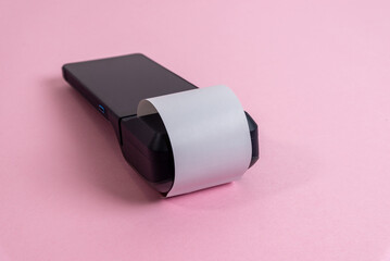 Portable POS terminal with printed receipt on pastel background, showcasing minimal product design, hardware interface aesthetics, and modern fintech device styling
