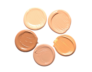 Foundation swatches in a star shape on a black background