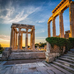 Fototapeta premium Ancient classical Greek ruins with columns at sunset.