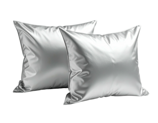 Two satiny square pillows, angled, on black