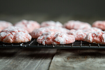 Homemade Strawberry and Red Velvet Crinkle Cookies on Cooling Rack. 