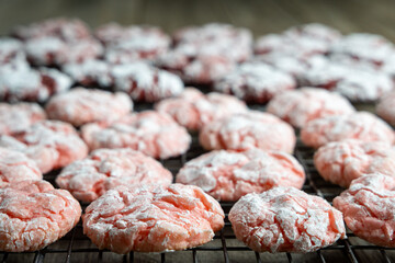 Homemade Strawberry and Red Velvet Crinkle Cookies on Cooling Rack. 