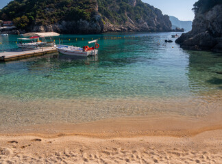 Obraz premium Panoramic view of the resort town of Paleokastritsa, sea and the cliffs of the Ionian Sea in Corfu, Greece