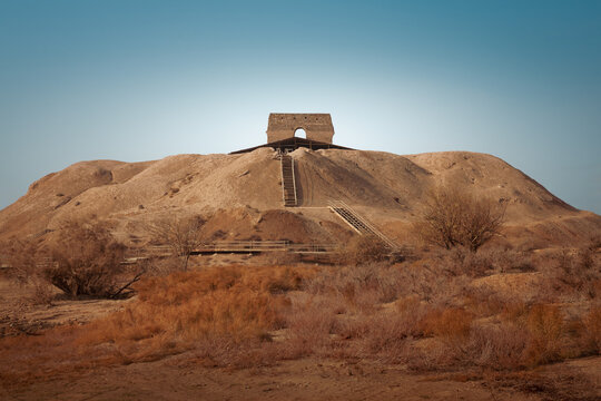 Bahram Fire Temple sitting atop Tappeh Mil hill in Rey, Iran, showcasing ancient Sasanian Persian architecture against a clear sky.