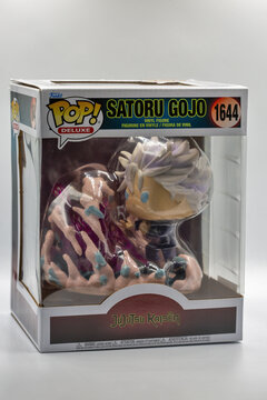 Satoru Gojo Funko deluxe collectible game figure closeup on white.