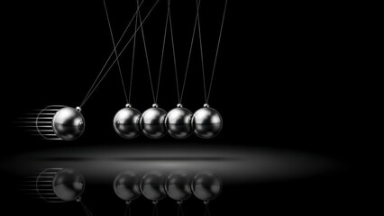 Newtons Cradle in Motion, Reflecting on a Dark Surface.