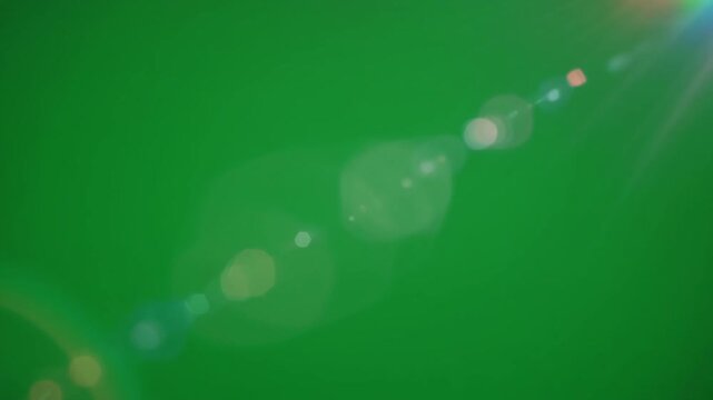 Green background rainbow light lens flare prism effect bokeh abstract colorful bright dreamy scene sun flare beam color spectrum