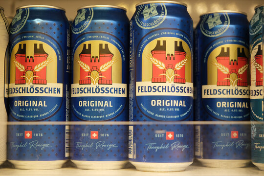 Brienz,Switzerland-Oct.1st 2025: Feldschl&ouml;sschen Original beer cans on a retail shelf.
