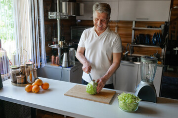 Man preparing food in kitchen with fresh ingredients
