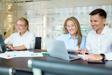 Team members collaborate in a modern office setting
